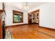 Bright living room featuring wood floors, fireplace and trim, and an open layout at 1308 York St, Denver, CO 80206