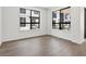 Light-filled bedroom with wood floors and modern windows at 2036 S Holly St # 4, Denver, CO 80222