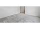A bedroom featuring neutral carpet, white walls, and a view into another room at 2036 S Holly St # 4, Denver, CO 80222