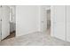 Bedroom featuring neutral carpet, white walls, and several doors and doorways at 2036 S Holly St # 4, Denver, CO 80222