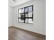 Bright bedroom with wood floors and modern window at 2036 S Holly St # 4, Denver, CO 80222