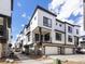Modern townhome featuring a private balcony and two car garage at 2036 S Holly St # 4, Denver, CO 80222