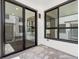 Private patio with glass sliding doors and recessed lighting is ideal for relaxing and entertaining at 2036 S Holly St # 4, Denver, CO 80222