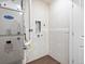 Utility room with wood-look vinyl floors and a new Carrier furnace and laundry hookups at 2036 S Holly St # 4, Denver, CO 80222