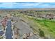 Stunning aerial view of the neighborhood showcasing lush greenery and a vibrant community at 2875 Blue Sky Cir # 4-303, Erie, CO 80516