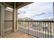 Balcony overlooks the complex parking lot and a distant mountain range at 2875 Blue Sky Cir # 4-303, Erie, CO 80516