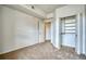 Open bedroom featuring neutral carpet and walk-in closet at 2875 Blue Sky Cir # 4-303, Erie, CO 80516