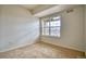 Bright bedroom with large window and neutral carpet at 2875 Blue Sky Cir # 4-303, Erie, CO 80516
