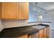 Kitchen featuring granite countertops, stainless steel dishwasher and sink at 2875 Blue Sky Cir # 4-303, Erie, CO 80516