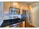 Kitchen close up with stainless steel appliances and granite countertops at 2875 Blue Sky Cir # 4-303, Erie, CO 80516