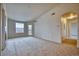 Bright living room with neutral carpet and access to the outside patio at 2875 Blue Sky Cir # 4-303, Erie, CO 80516
