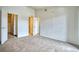 Large bedroom featuring neutral carpet, walk-in closet and ensuite bathroom at 2875 Blue Sky Cir # 4-303, Erie, CO 80516