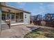 This backyard offers a covered patio, a concrete patio and green space, perfect for outdoor entertaining at 8992 E 5Th Pl, Denver, CO 80230