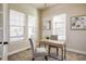 Home office featuring neutral walls, carpeted floors, and natural light from windows at 8992 E 5Th Pl, Denver, CO 80230