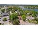 Panoramic aerial view of the property in a verdant neighborhood near a picturesque lake at 2180 Myrtlewood Ln, Lakewood, CO 80215