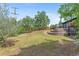 Expansive backyard with terraced landscaping and mature trees offers a private outdoor retreat at 2180 Myrtlewood Ln, Lakewood, CO 80215