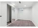 This carpeted bedroom has recessed lights, a mirrored closet and a bright window at 2180 Myrtlewood Ln, Lakewood, CO 80215