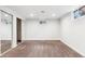 This large, carpeted bedroom has recessed lights, a sliding closet, and a window at 2180 Myrtlewood Ln, Lakewood, CO 80215