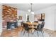 Dining room featuring a fireplace, round table, and modern decor at 2180 Myrtlewood Ln, Lakewood, CO 80215