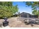 Home with a large driveway, mature trees, and a well-maintained front yard at 2180 Myrtlewood Ln, Lakewood, CO 80215