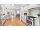 Bright updated kitchen showcasing stainless steel appliances and an open layout at 2180 Myrtlewood Ln, Lakewood, CO 80215