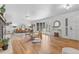 Bright living room with hardwood floors, a bay window, and stylish furnishings at 2180 Myrtlewood Ln, Lakewood, CO 80215