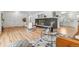 Spacious open floor plan with hardwood floors and modern decor and fireplace in the living area at 2180 Myrtlewood Ln, Lakewood, CO 80215
