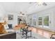 Spacious open-concept living room with view to the kitchen and hardwood floors at 2180 Myrtlewood Ln, Lakewood, CO 80215