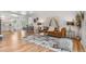 Open concept living area featuring hardwood floors, stylish decor, and comfortable seating at 2180 Myrtlewood Ln, Lakewood, CO 80215