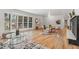 Bright and open living space with hardwood floors, bay windows, and stylish furnishings at 2180 Myrtlewood Ln, Lakewood, CO 80215