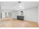 This living room features white walls, light wood floors, a bar with cabinets and French doors at 2180 Myrtlewood Ln, Lakewood, CO 80215