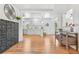 Inviting open-concept living area with a fireplace, bright lighting, and beautiful hardwood floors at 2180 Myrtlewood Ln, Lakewood, CO 80215