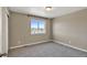 Simple bedroom with neutral tones, carpet, a window, and ample space at 1677 Valley Oak Ct, Castle Rock, CO 80104