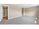 Bright bedroom with neutral walls, plush carpeting and an ensuite bathroom with a glass-enclosed shower at 1677 Valley Oak Ct, Castle Rock, CO 80104