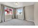 Sunny bedroom with two large windows, neutral walls, plush carpet, and modern window treatments at 1677 Valley Oak Ct, Castle Rock, CO 80104