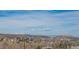 Scenic view showcasing the community with mountains and a vast, picturesque skyline in the background at 1677 Valley Oak Ct, Castle Rock, CO 80104