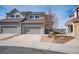 Exterior view of a multi-story home with a two-car garage and well maintained landscaping at 1677 Valley Oak Ct, Castle Rock, CO 80104