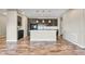 Spacious kitchen featuring dark cabinetry, a large island, and an open layout perfect for entertaining at 1677 Valley Oak Ct, Castle Rock, CO 80104