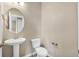Clean powder room with white fixtures, neutral walls, and modern faucet at 1677 Valley Oak Ct, Castle Rock, CO 80104