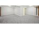 Spacious basement with new carpeting and large closet space for storage or customization at 9338 W Utah Pl, Lakewood, CO 80232