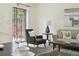 The living room is bright and airy, with a glass sliding door and hardwood floors at 9338 W Utah Pl, Lakewood, CO 80232