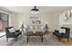 A comfortable living room space with hardwood floors, neutral decor, and natural light at 9338 W Utah Pl, Lakewood, CO 80232