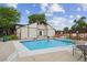 Community pool featuring lounge chairs, secure fencing, and a relaxing atmosphere at 9338 W Utah Pl, Lakewood, CO 80232