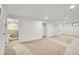 Spacious finished basement leading to a bathroom and separate room at 3798 S Wabash St, Denver, CO 80237