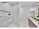 A beautifully designed bathroom featuring a tiled shower, marble accents, and a modern vanity at 3798 S Wabash St, Denver, CO 80237