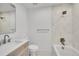 A stylish bathroom featuring a tiled shower/tub combination and modern vanity at 3798 S Wabash St, Denver, CO 80237