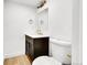 Charming powder room with modern vanity, fixtures, and hardware at 3798 S Wabash St, Denver, CO 80237