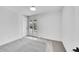 A bright bedroom features light gray carpet, white walls, and French doors at 3798 S Wabash St, Denver, CO 80237