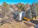 Modern two-story home featuring a gray roof, white paint, black mulch and small balcony at 3798 S Wabash St, Denver, CO 80237