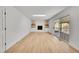 A well-lit, open living room with a modern fireplace, built-in shelving and sliding glass door to the exterior at 3798 S Wabash St, Denver, CO 80237